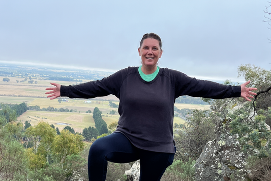 Emma from the printable place standing on a rock at Hanging Rock in Victoria