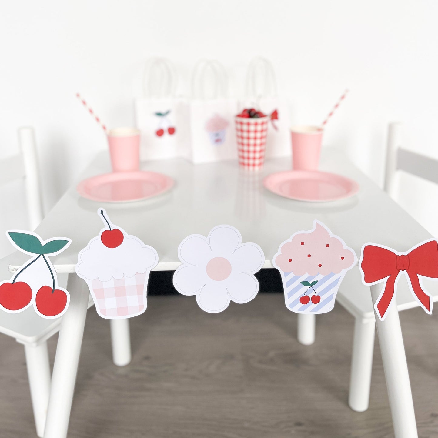 Cherry Theme printables set up as a birthday party by The Printable Place