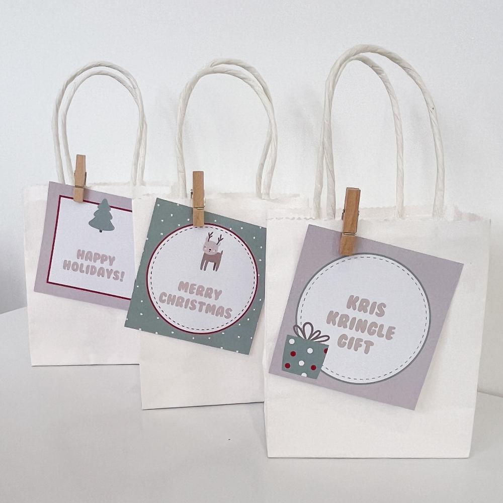 Cute beige reindeer and Christmas themed gift tags on bags