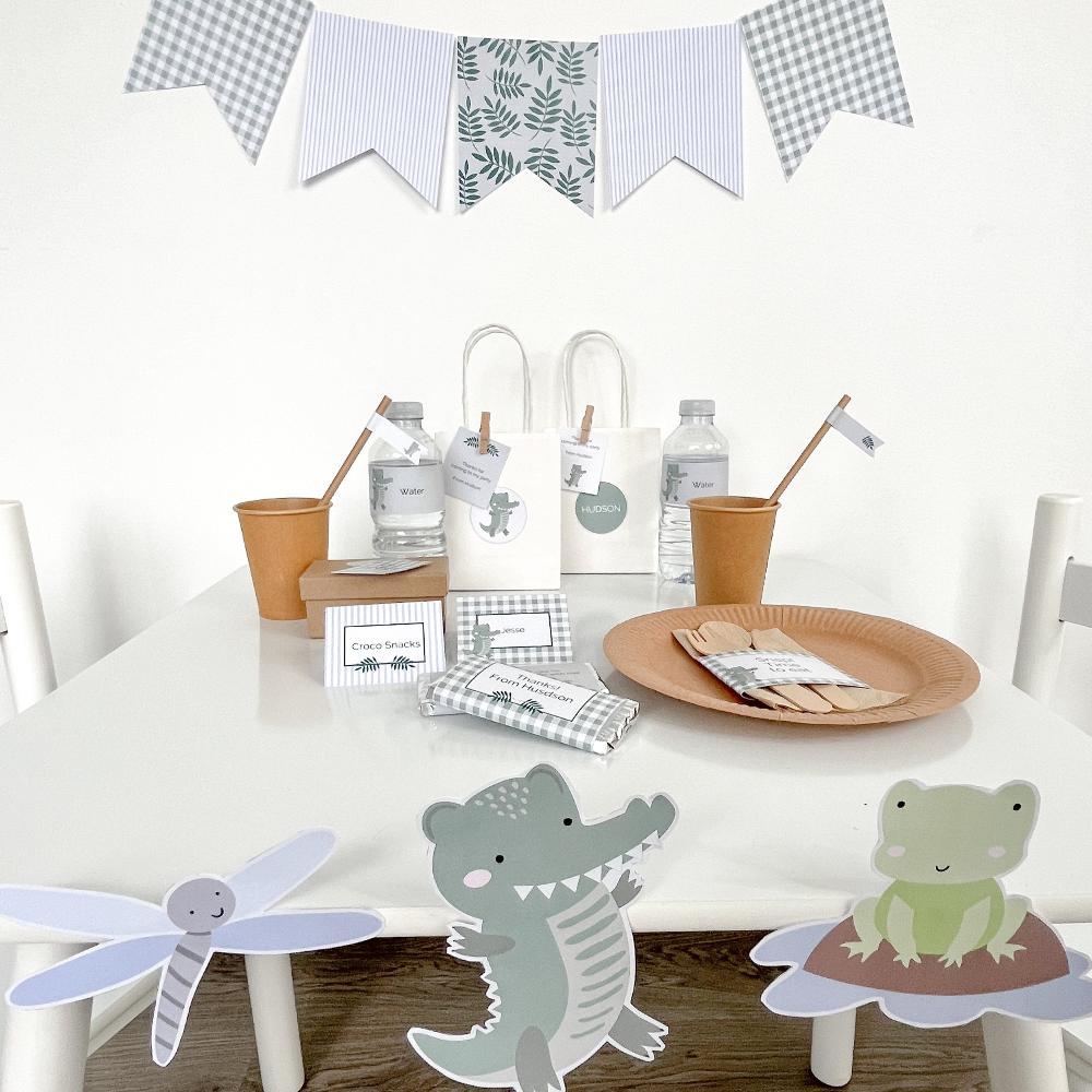 Crocodile party table set up with printable decorations