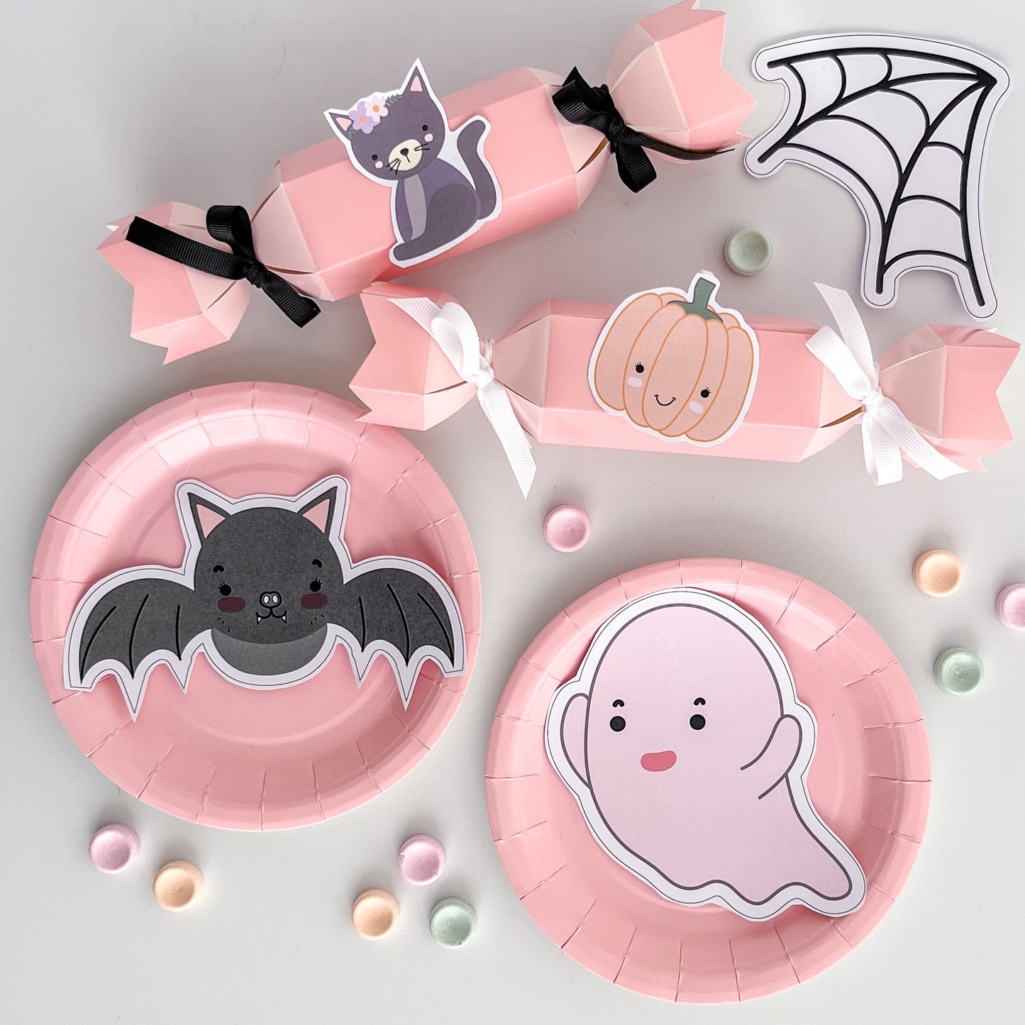 Cute pastel halloween shapes on pink partyware