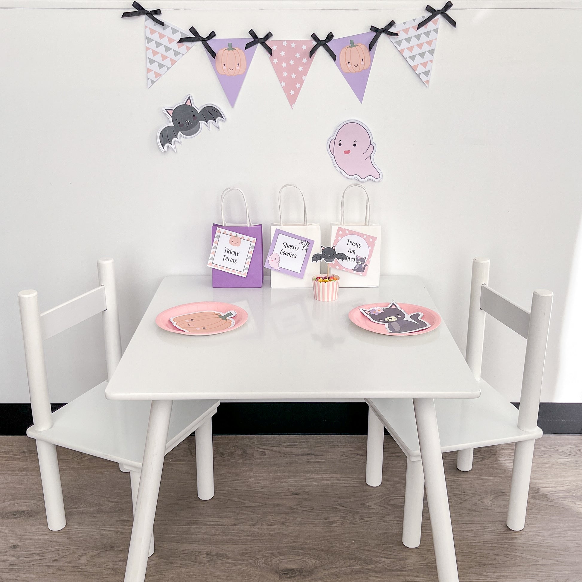 Halloween themed party table in pastels