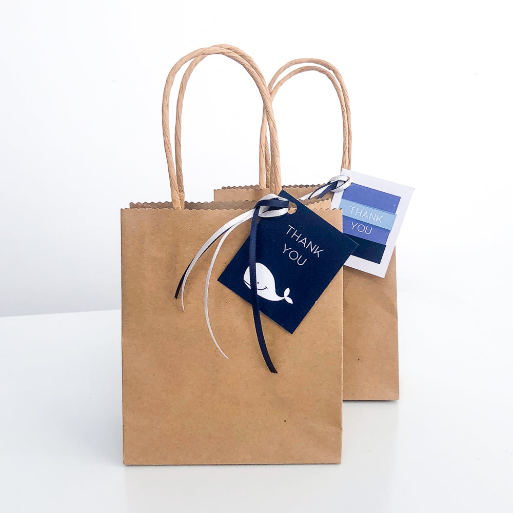 Gift Bags with Blue whale themed Gift tags on them. 